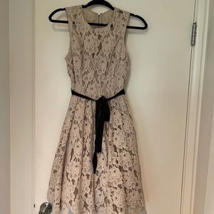 Nude lace dress with black grosgrain ribbon belt